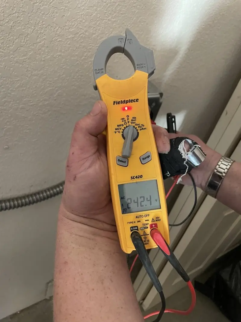 Voltage testing with clamp meter during Outlet Installation in Gardena